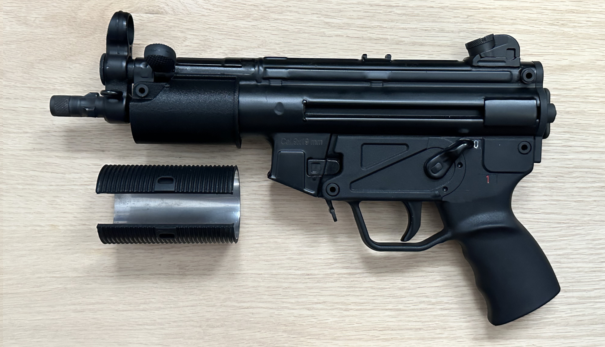 A picture of the BL-SD adapter partly installed onto an MP5K.