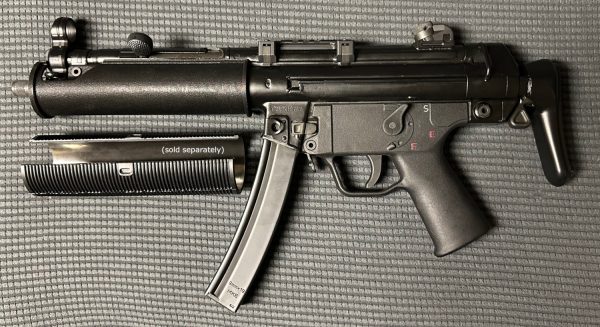 A picture of an MP5 wearing the BL-SD adapter, with the German rubber shroud next to it. The German rubber shroud is sold separately.