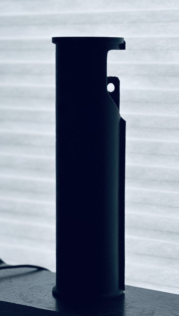 A picture of the BL-SD Handguard Adapter sitting vertically on the table.