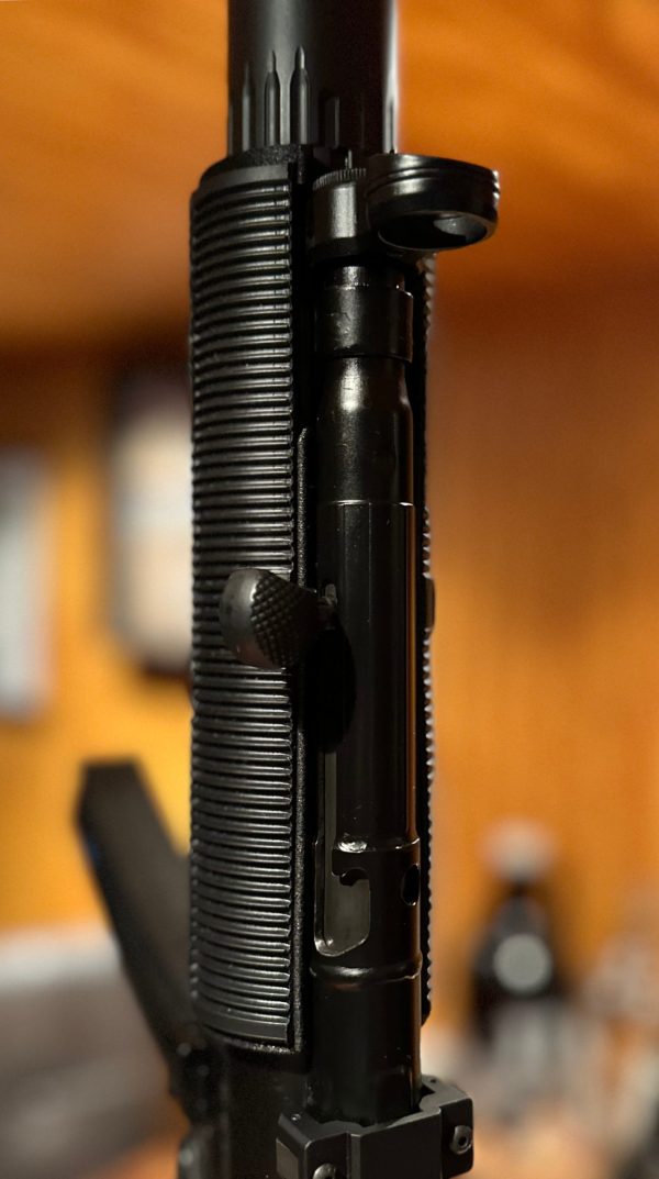 A closeup picture of a fake MP5SD made using a printed adapter, a rubber shroud, and a YHM R9.