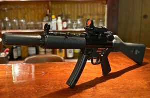 A picture of a fake MP5SD made using a printed adapter, a rubber shroud, and a YHM R9.