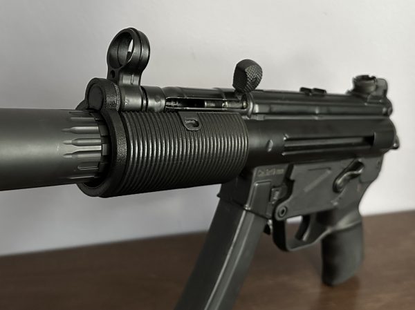 An AP5-P with the BL-SD-K adapter and a Broad River Tactical shroud viewed from the front